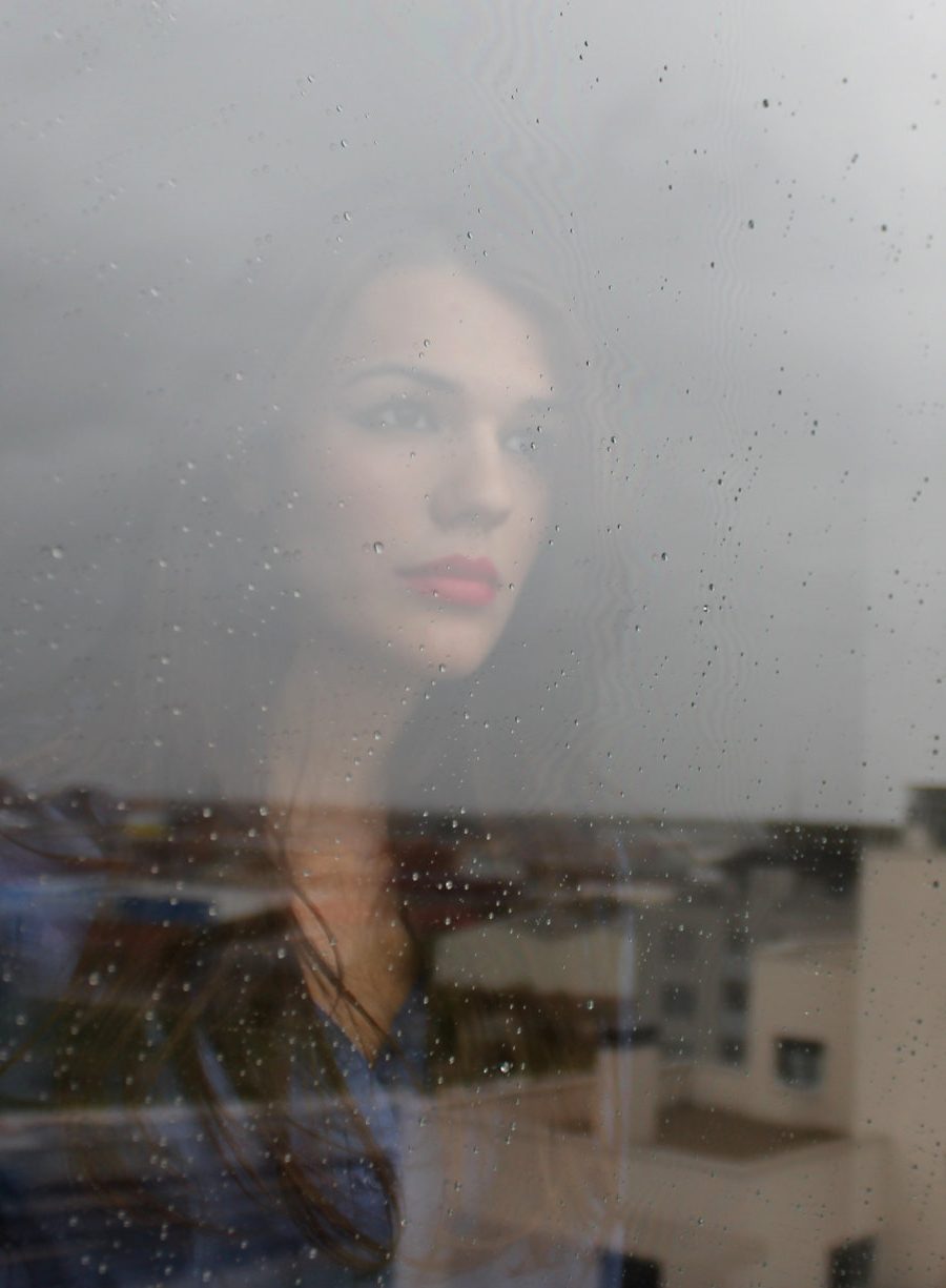 woman-at-window-looking-for-Restore